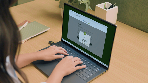User touching YubiKey to authenticate and instantly log into their account